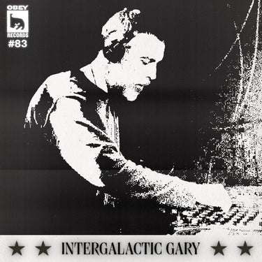 Black and white image of a man with headphones DJ'ing