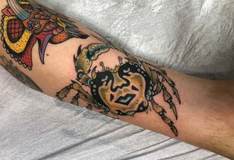 photo of colorful crab tattoo on a person's arm for tattoo episodes