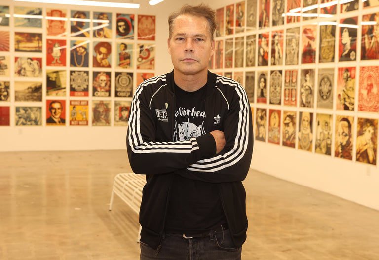 Shepard fairey standing in art gallery