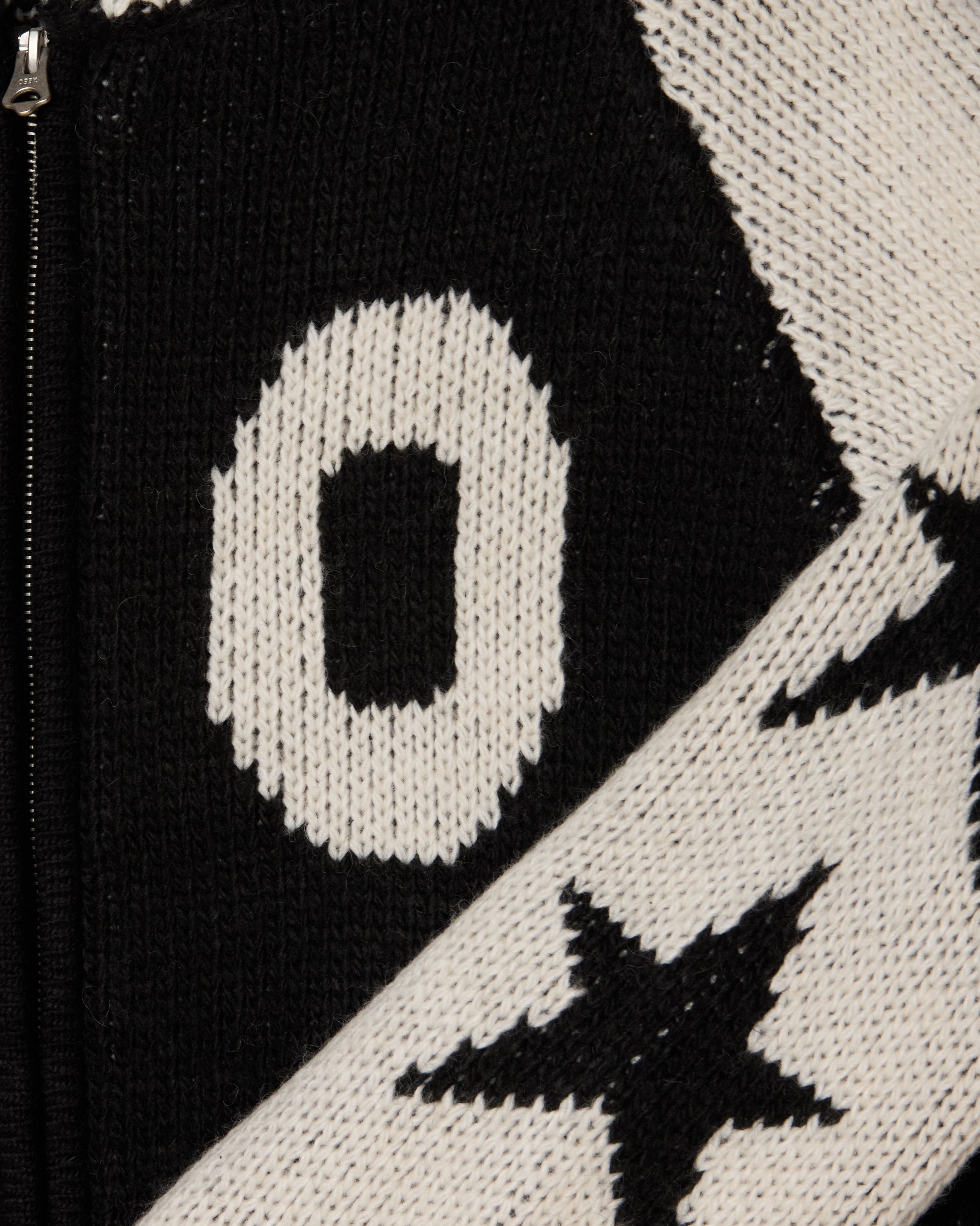 INT. COWICHAN SWEATER (zoomed)
