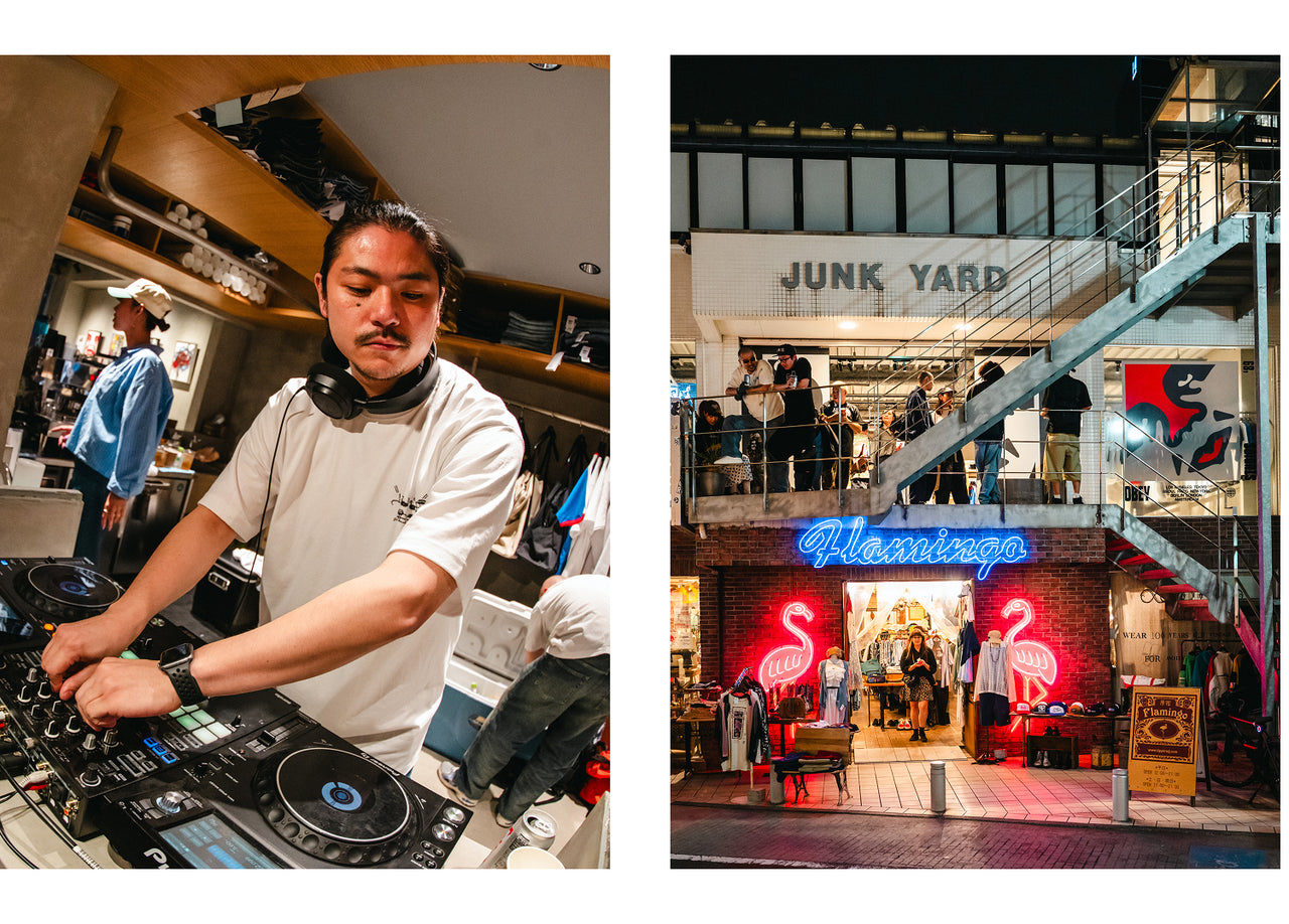 DJ behind booth with a vibrant urban scene in the background.